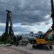 Piling and drilling machinery on gravel surface